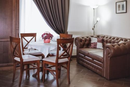 a living room with a couch and a table at Ekaterinoslav in Dnipro