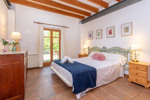 Villa Muscarolas By home villas 360 tesisinde bir odada yatak veya yataklar