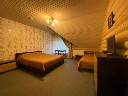Postel nebo postele na pokoji v ubytování Mini Hotel Zakrut