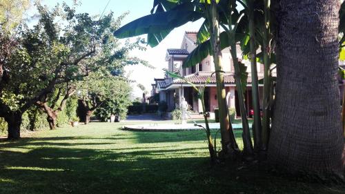 a group of trees in front of a house at Luconi Affittacamere in Iesi