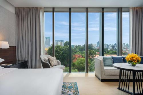 a living room with a view of a city at Hyatt Regency Phnom Penh in Phnom Penh