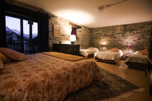 En eller flere senger på et rom på Gite L'Aurienchon