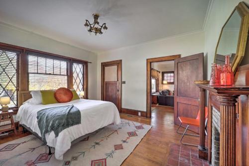 a bedroom with a bed in a room with a fireplace at Bristol Bungalow Less Than 1 Mi to Country Music Museum in Bristol