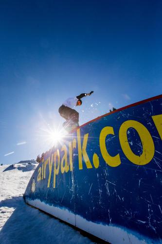 a person riding a snowboard on top of a sign at Gästehaus Biobauernhof Mandl in Murau