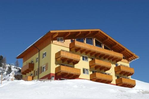 a building with snow in front of it at Fewo-Obertauern-Freja in Obertauern