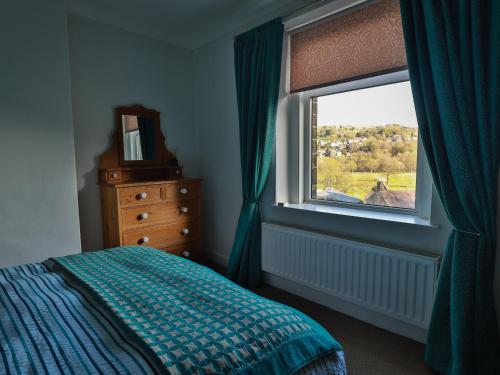 Postel nebo postele na pokoji v ubytování Wren Cottage