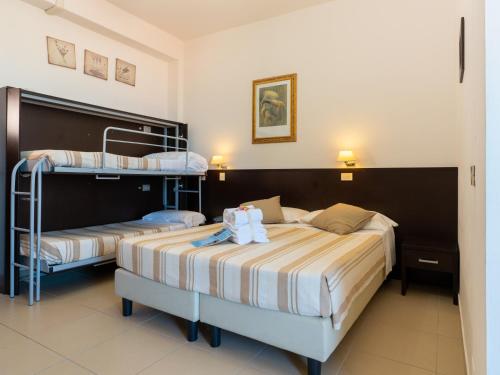 Llit o llits en una habitació de Hotel Ancore