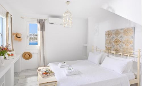 Postel nebo postele na pokoji v ubytování IThea Villa Mykonos