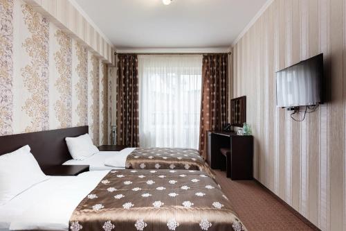 Postel nebo postele na pokoji v ubytování Kasimir Resort Hotel & SPA