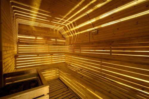 a wooden sauna with lights on top of it at Katalina SPA Resort in Tsigov Chark