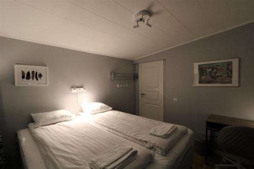 Una cama o camas en una habitación de RIBO Apartment Aurora
