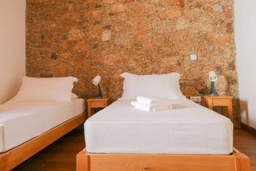 Ένα ή περισσότερα κρεβάτια σε δωμάτιο στο Casas do Torreão 3 casas de alojamento local