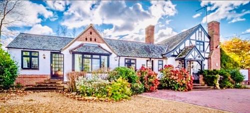 a large white house with at The Stanwick Hotel in Stanwick