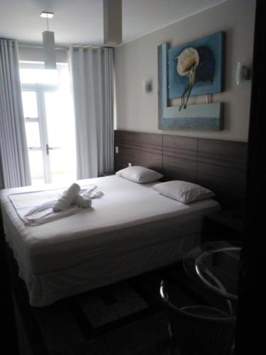 Postel nebo postele na pokoji v ubytování Hotel Toulon