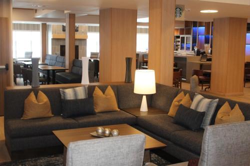 a living room filled with furniture and a coffee table at Hyatt Place Fairbanks in Fairbanks