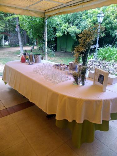 a table with wine glasses on top of it at Casa Dos Arrabidos in Torres Novas