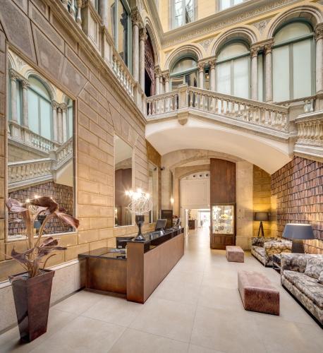 a lobby of a building with a staircase at Catalonia Portal de l'Angel in Barcelona