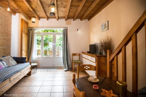 a living room with a couch and a table at Domaine de Beaufort in Saint-Front-de-Pradoux