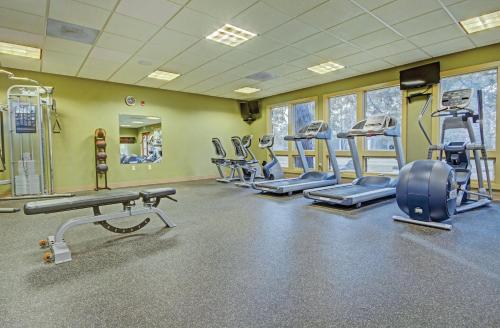 a fitness room with treadmills and cardio equipment at Seventh Mountain Resort in Bend