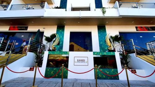 a building with a sign on the side of it at Kandi Palace in Angeles