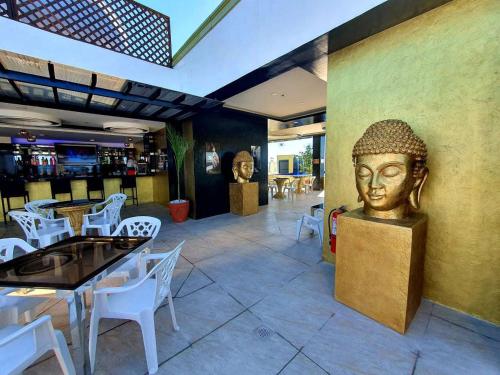 a statue of a head on a wall in a restaurant at Kandi Palace in Angeles