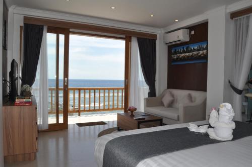 Giường trong phòng chung tại SUITE OCEAN BLUE