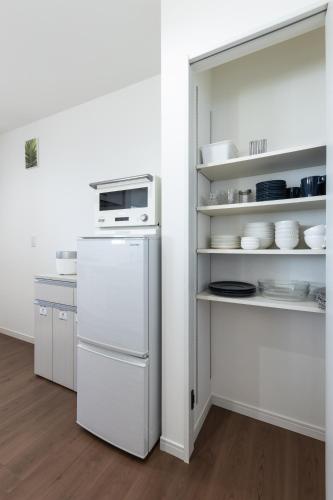 Dapur atau dapur kecil di The Beachfront House ビーチフロントの一軒家 4名迄