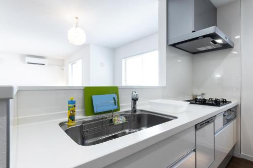 Dapur atau dapur kecil di The Beachfront House ビーチフロントの一軒家 4名迄