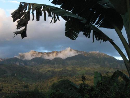 a view of a mountain range with clouds in the sky at Aire Libre Descanso in San Francisco