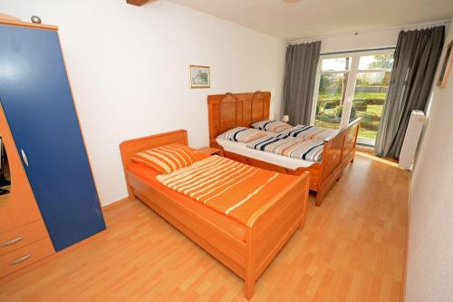 Tempat tidur dalam kamar di Hof Brinker - Kuhstall