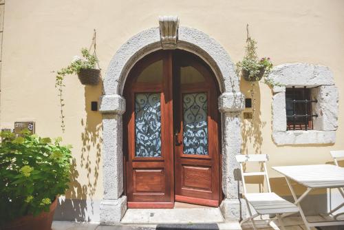 an entrance to a house with a wooden door at Old Town Inn in Rijeka