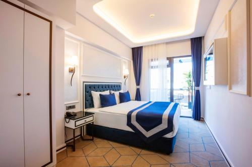 Llit o llits en una habitació de Endican Beyazit Hotel