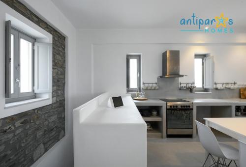 a kitchen with a counter with a tablet on it at Antiparos Homes in Antiparos Town