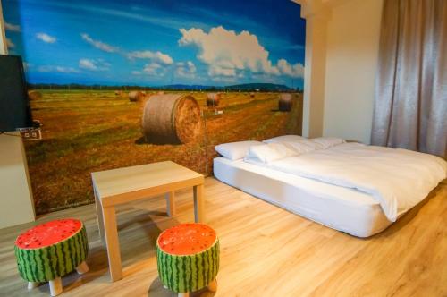 Cama o camas de una habitación en 綠竹弄親子民宿附設背包客房