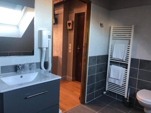Ένα μπάνιο στο Hôtel & Appartements Le Florence
