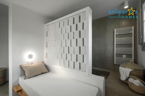 a room with a white couch in a room at Antiparos Homes in Antiparos Town