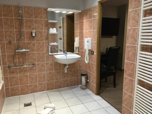 Ένα μπάνιο στο Hôtel & Appartements Le Florence