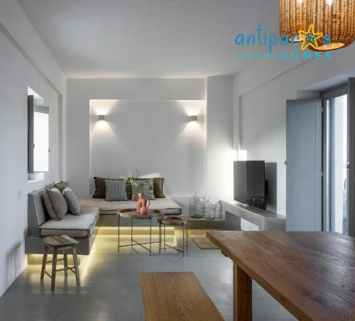 a living room with a couch and a table at Antiparos Homes in Antiparos Town