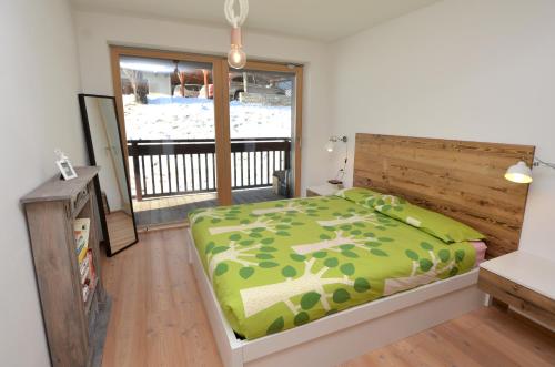 Ένα ή περισσότερα κρεβάτια σε δωμάτιο στο Aurturist Valdaora Roulette