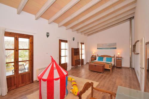 a living room with a bed and a room with a tent at 015 Casa de Pueblo ETV6811 by Mallorca Charme in Muro