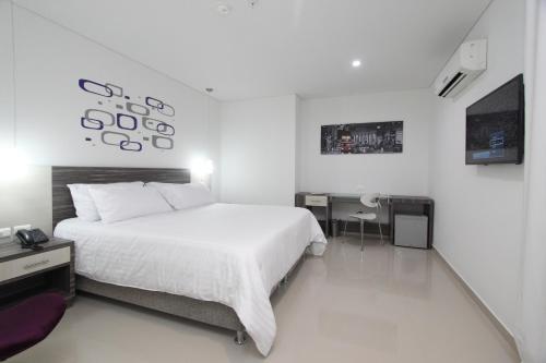 TV a/nebo společenská místnost v ubytování Hotel Oxford Barranquilla