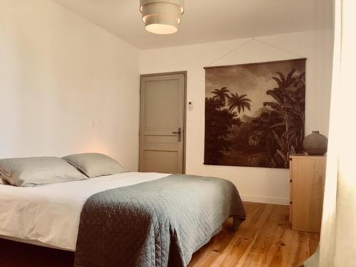 Ein Bett oder Betten in einem Zimmer der Unterkunft La Villa l Orangerie