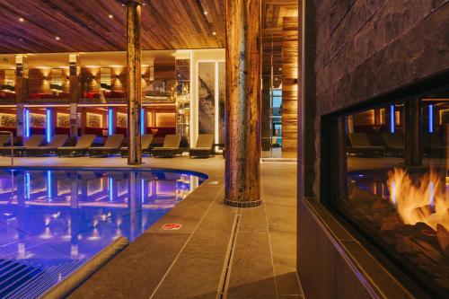 a pool in a hotel with a swimming pool at Ortner's Resort in Bad Füssing