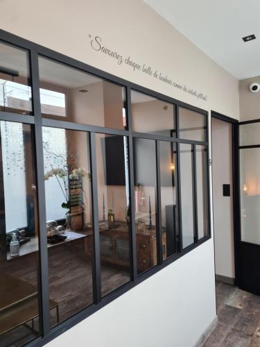 a store window with a sign that readssaving mirrors will be the answer to everything at Ma nuit ô spA in Reims