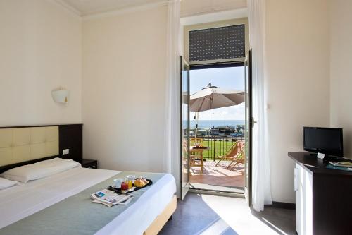 Posteľ alebo postele v izbe v ubytovaní Hotel Bellavista