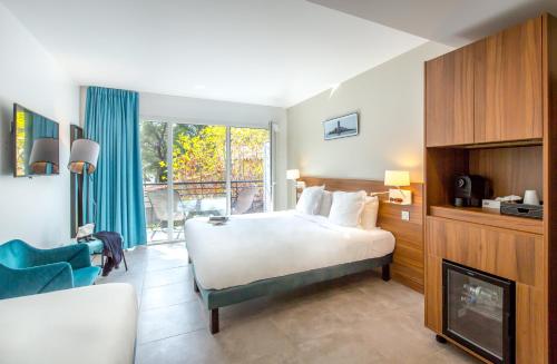 Postel nebo postele na pokoji v ubytování SOWELL HOTELS La Plage
