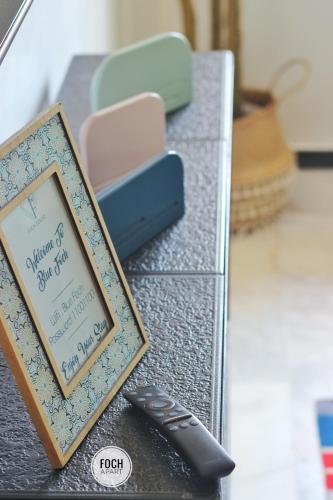 a table with a sign and a remote control at AiM HOUSE in Marrakech