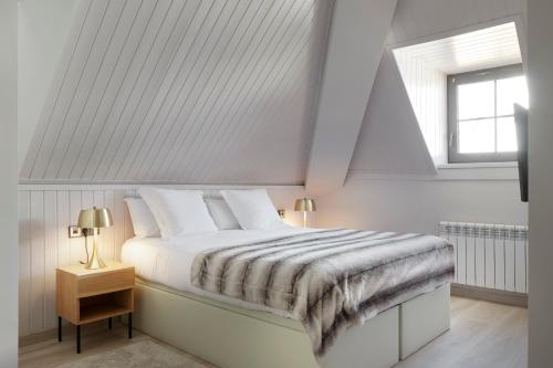 Ένα ή περισσότερα κρεβάτια σε δωμάτιο στο Pujolo by FeelFree Rentals