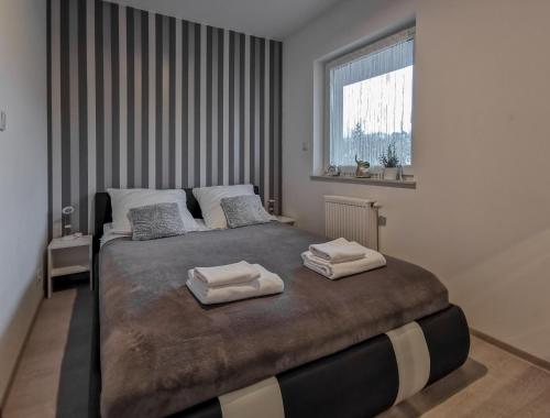 Postel nebo postele na pokoji v ubytování Apartament Kopydło