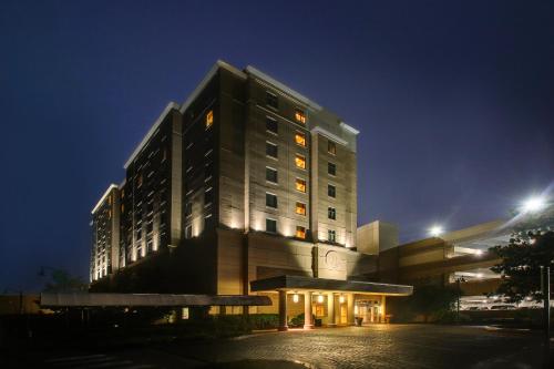 a building at night with a bench in front of it at Hollywood Casino Bangor in Bangor